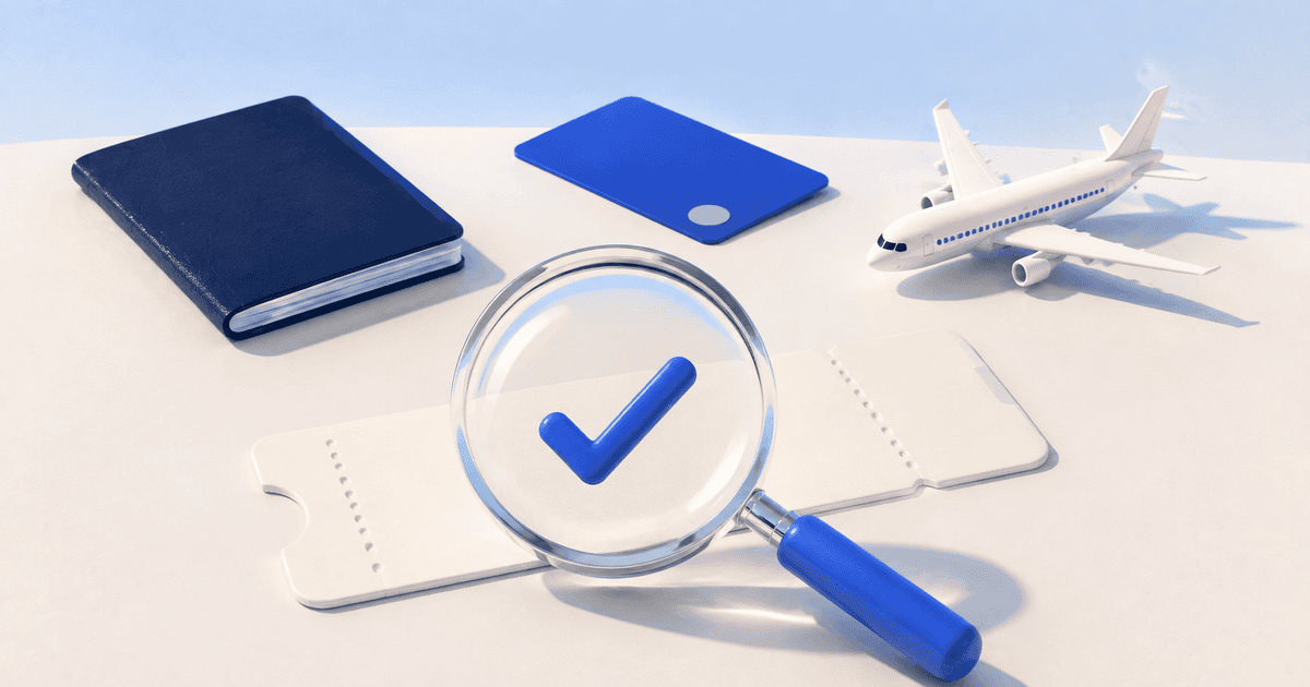 Magnifying glass with a blue check over a boarding pass beside a passport, payment card, and model airplane